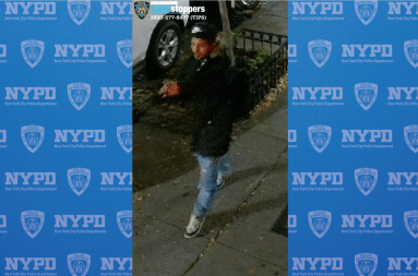 suspect wearing dark clothes who allegedly robbed a woman in Hell's Kitchen in Manhattan