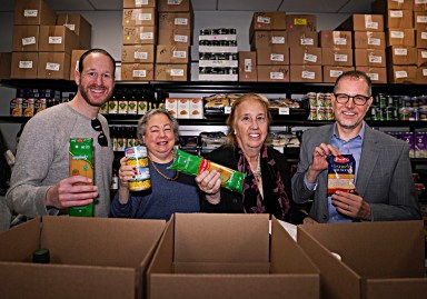 Met Council and pols with Thanksgiving food items donated to needy