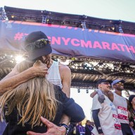 NYC Marathon runner embraces girl at finish line