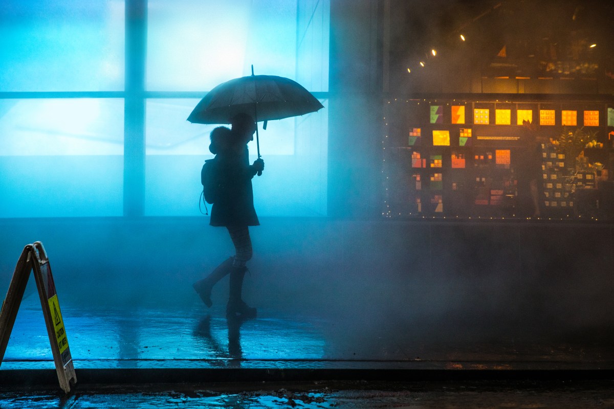 NYC drought rain storm person with umbrella