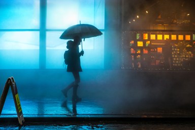 NYC drought rain storm person with umbrella