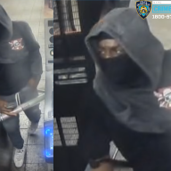 man wearing black mask who allegedly took part in Manhattan train robbery spree