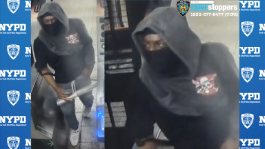 man wearing black mask who allegedly took part in Manhattan train robbery spree