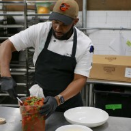 man preparing food in a kitchen