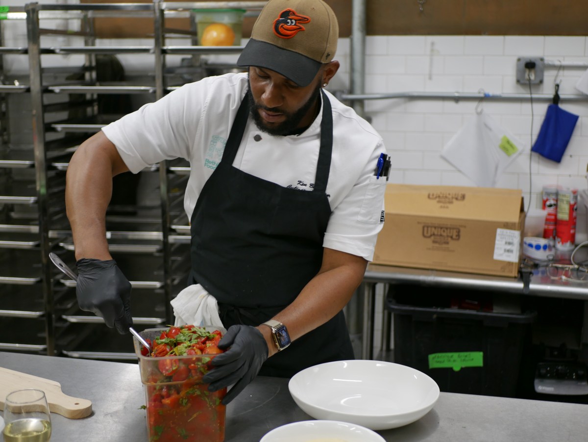 man preparing food in a kitchen