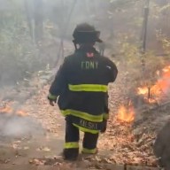 Firefighter at Inwood Hill Park battles wildfire