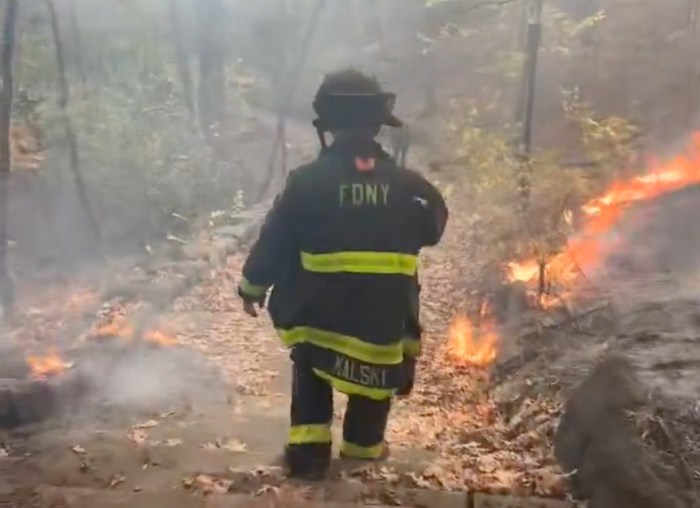 Firefighter at Inwood Hill Park battles wildfire