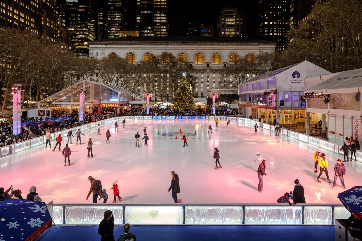 Ice skaters on the rink at Bank of America Winter Village at Bryant Park.