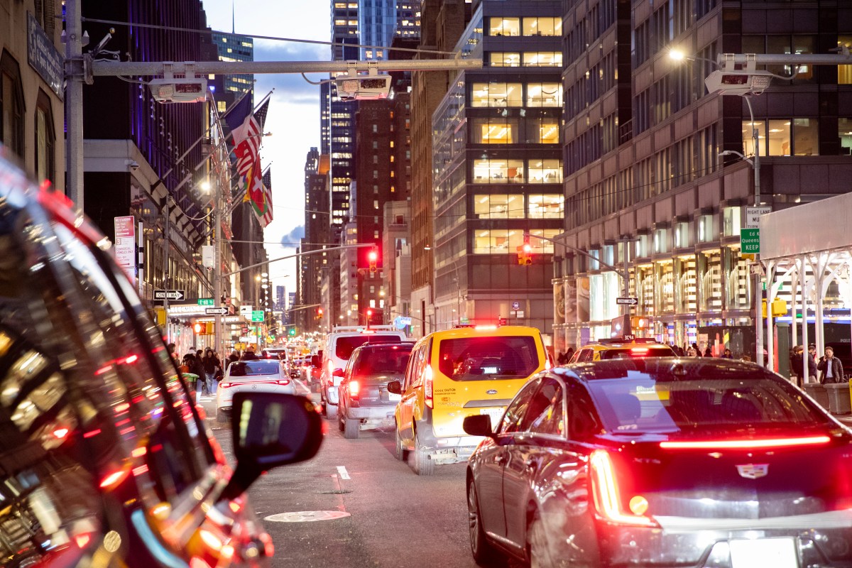 Congestion pricing gantry during rush hour traffic in Manhattan