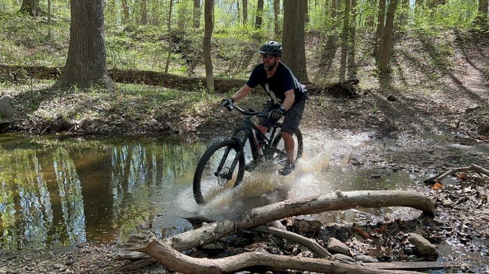 man on a bike in the woods