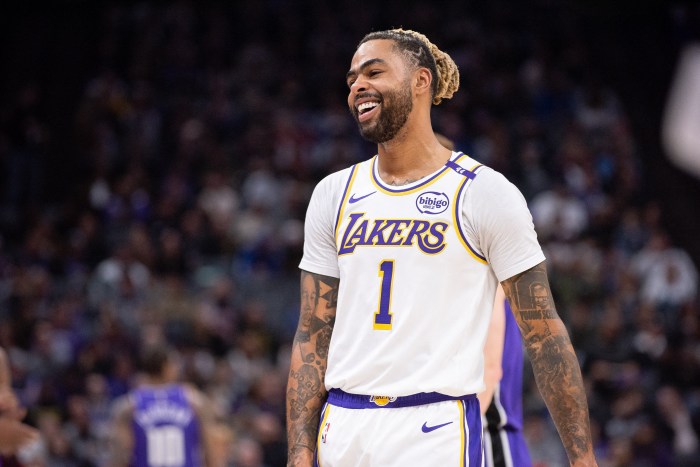 Dec 21, 2024; Sacramento, California, USA; Los Angeles Lakers guard D'Angelo Russell (1) smiles during a time out in the second quarter of the game against the Sacramento Kings at Golden 1 Center. Mandatory Credit: Ed Szczepanski-Imagn Images