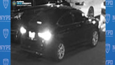 The getaway car shown in surveillance footage after a fatal shooting in Brooklyn.