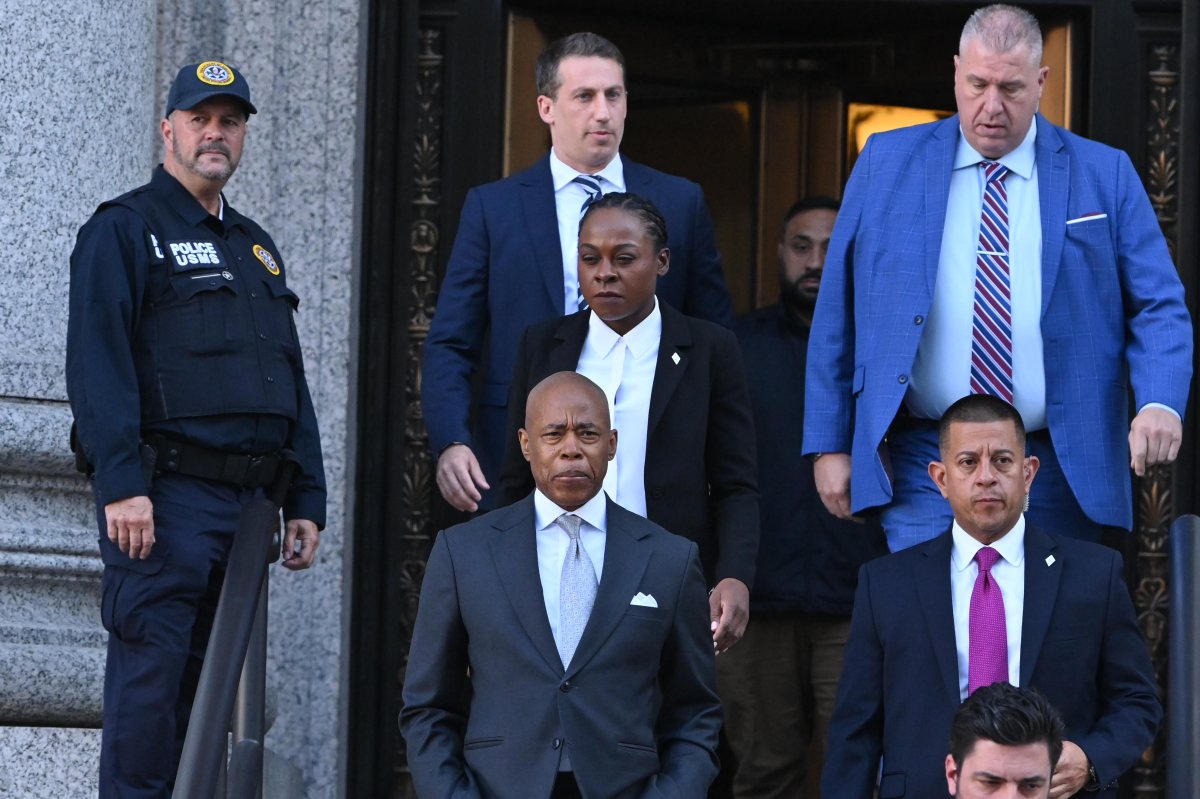 Mayor Eric Adams exits a Nov. 1 federal court conference with his legal team and security detail.