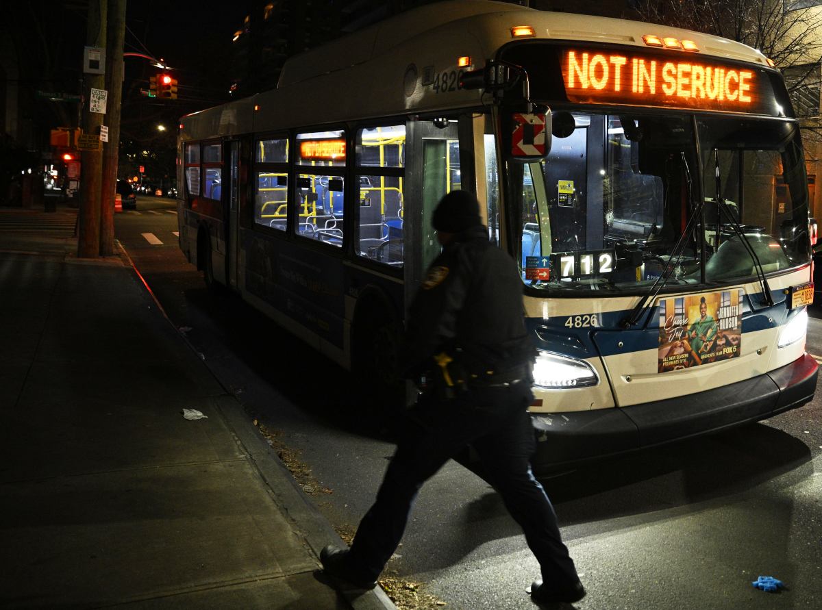 Cop in Brooklyn walks by bus after man shot with stray bullet