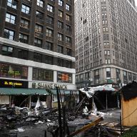 A fire heavily damaged several booths at the Herald Holiday Market.