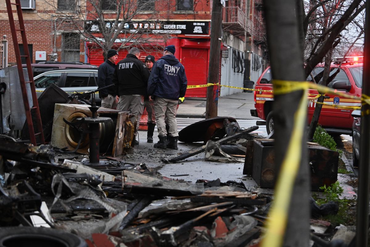 Fire Marshals investigate the scene of a fatal fire at 516 Vermont St. in East New York, Brooklyn on Dec. 17, 2024.