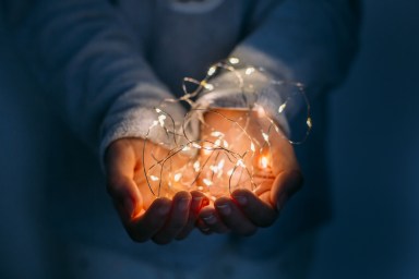 christmas light on hands