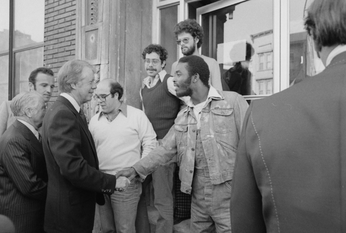 Jimmy Carter shakes hands with South Bronx resident