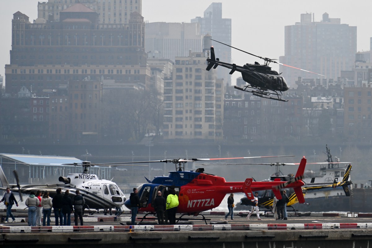 Helicopters landing and waiting at Downtown Manhattan Heliport