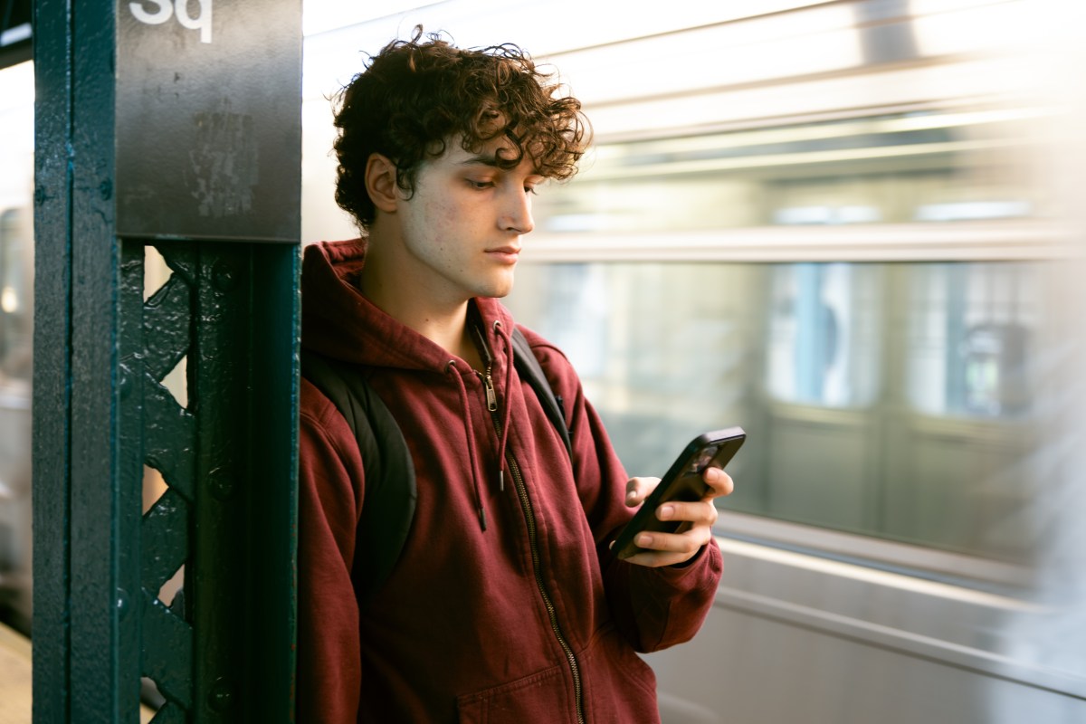 College student waiting at NYC subway station