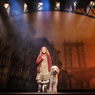 Hazel Vogel as Annie, with Kevin as Sandy, in the 2024 production of "Annie" at MSG, directed by Jenn Thompson.