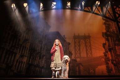 Hazel Vogel as Annie, with Kevin as Sandy, in the 2024 production of "Annie" at MSG, directed by Jenn Thompson.