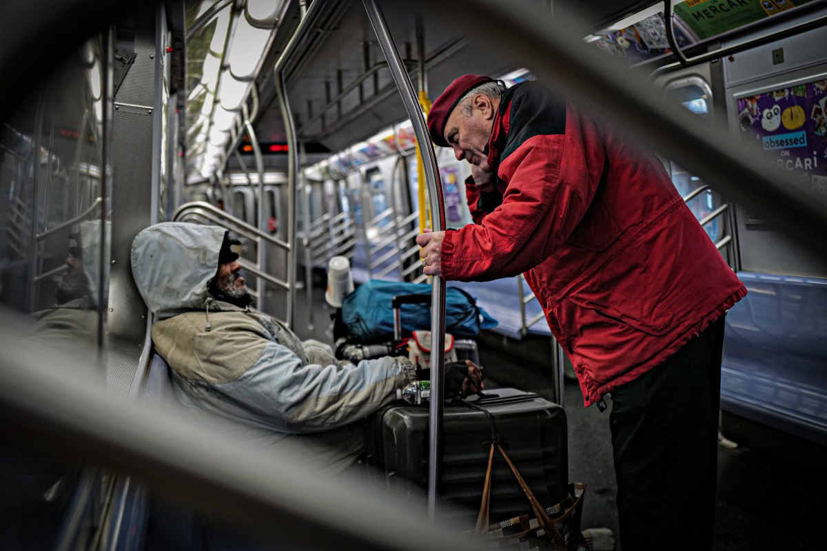 Guardian Angels Founder Curtis Sliwa with a homeless man on board a subway train at the Coney Island-Stillwell Avenue station on Dec. 29, 2024.