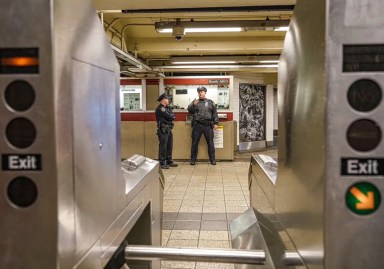 FILE - Transit police at scene of subway slashing