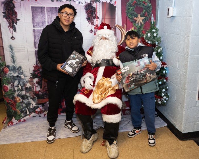 Santa at unique Manhattan toy store with kids