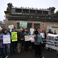 people outside near a bus stop rallying for better bus service in Brooklyn