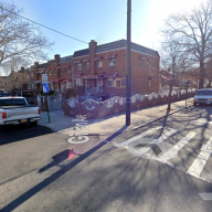 intersection in the Bronx in Eastchester showing a crosswalk and cars