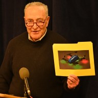 Sen. Schumer holds a photo of a drone at a press conference about drone sightings in NYC