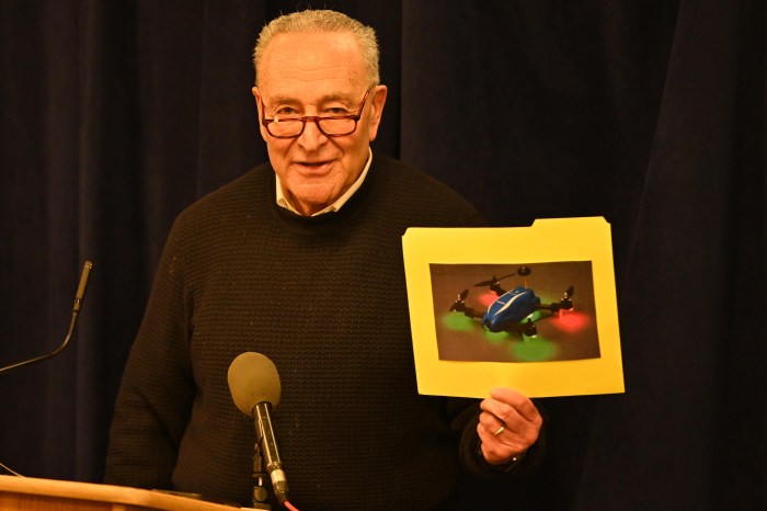 Sen. Schumer holds a photo of a drone at a press conference about drone sightings in NYC