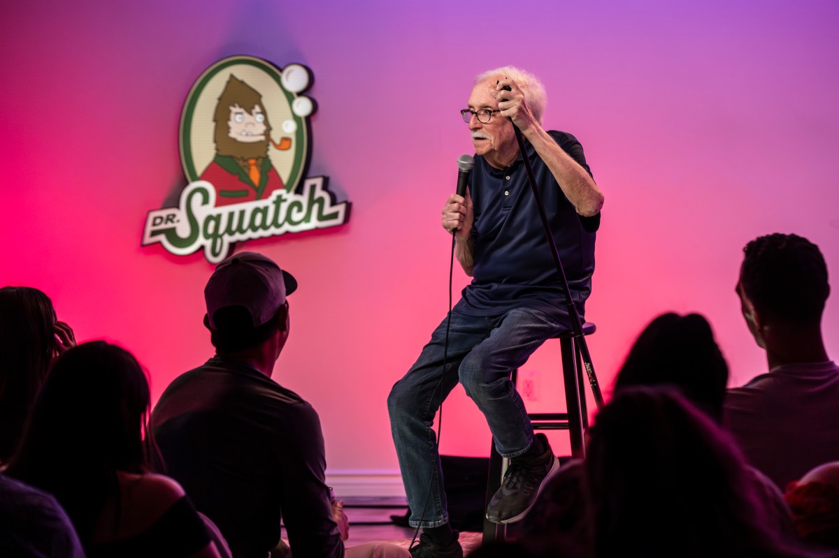 Comedian Andy Huggins performs at a Don't Tell Comedy show.