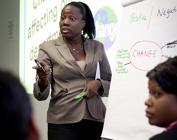 CUNY Professional Development Program. In photo: Karen Thomas, Associate Registrar at Bronx Community College, presents her group's diagram of dealing with change.