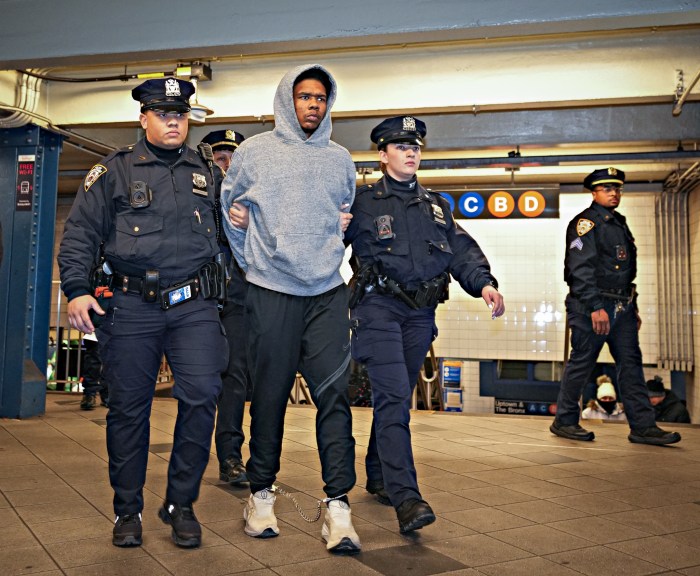 A police arresting a man.