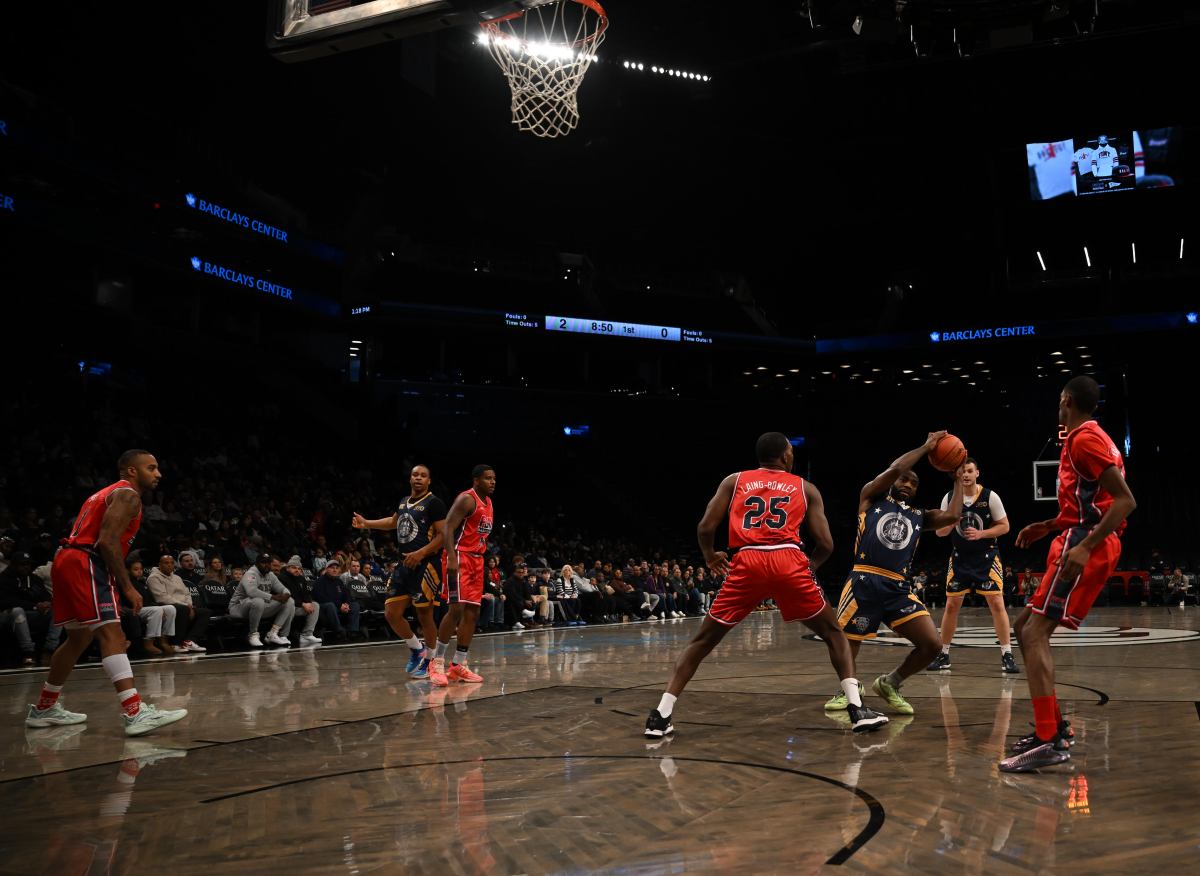 The NYPD and FDNY play in the charity basketball game.