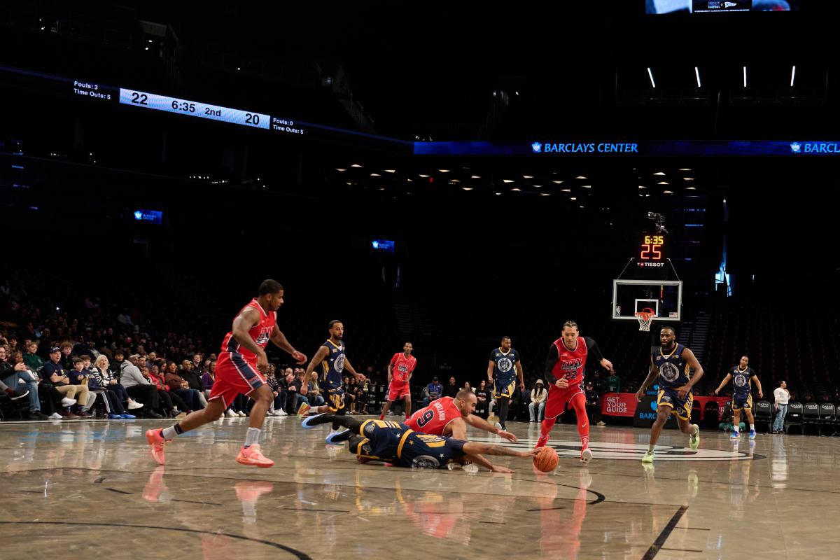 The NYPD and FDNY play in the charity basketball game.