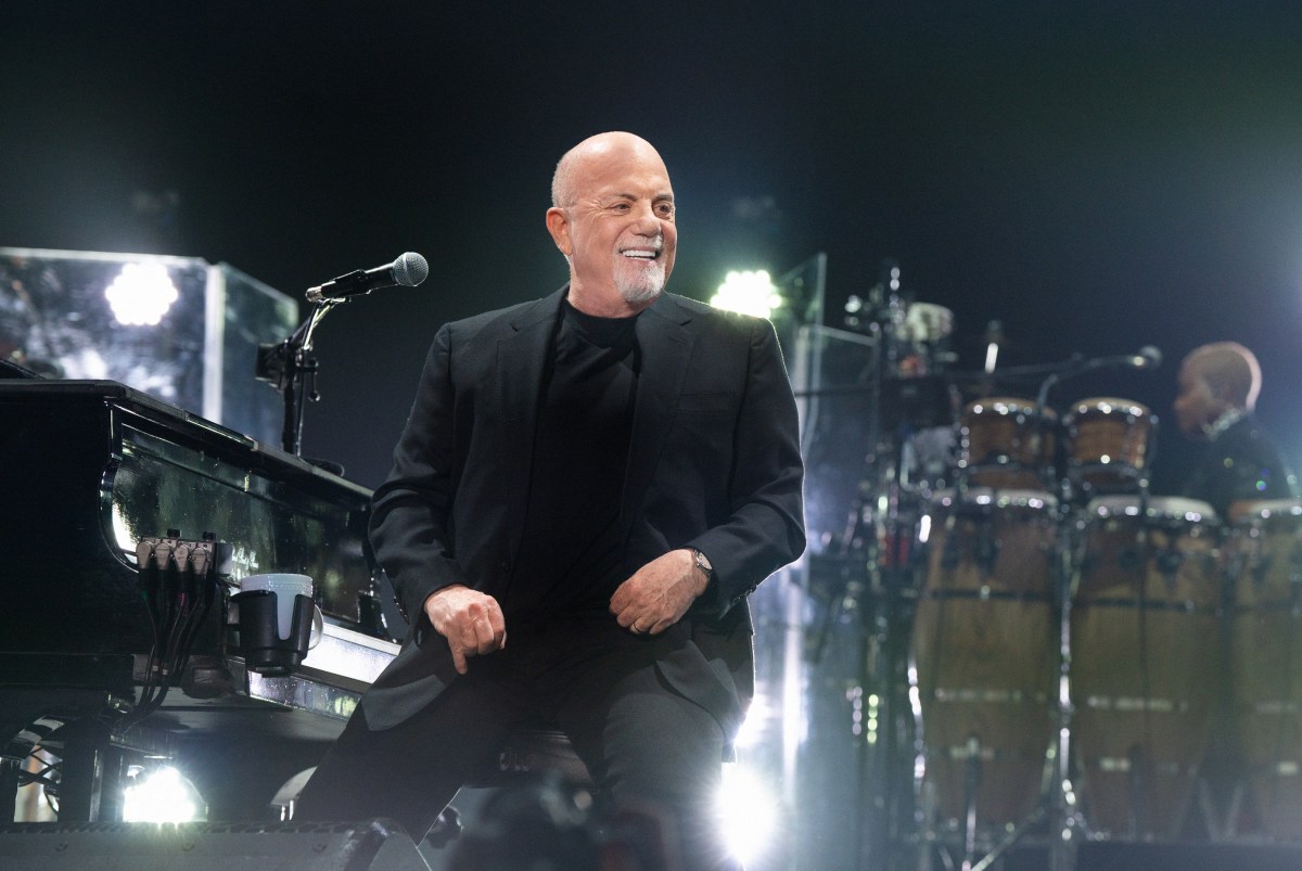 Billy Joel singing at concert