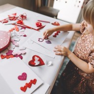 Toddler making greeting card for mom and dad at home