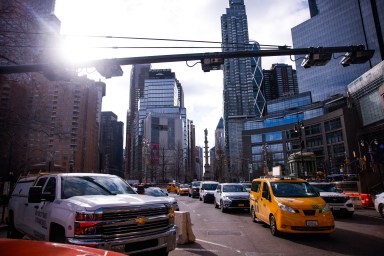 Cars operating at congestion pricing gantry