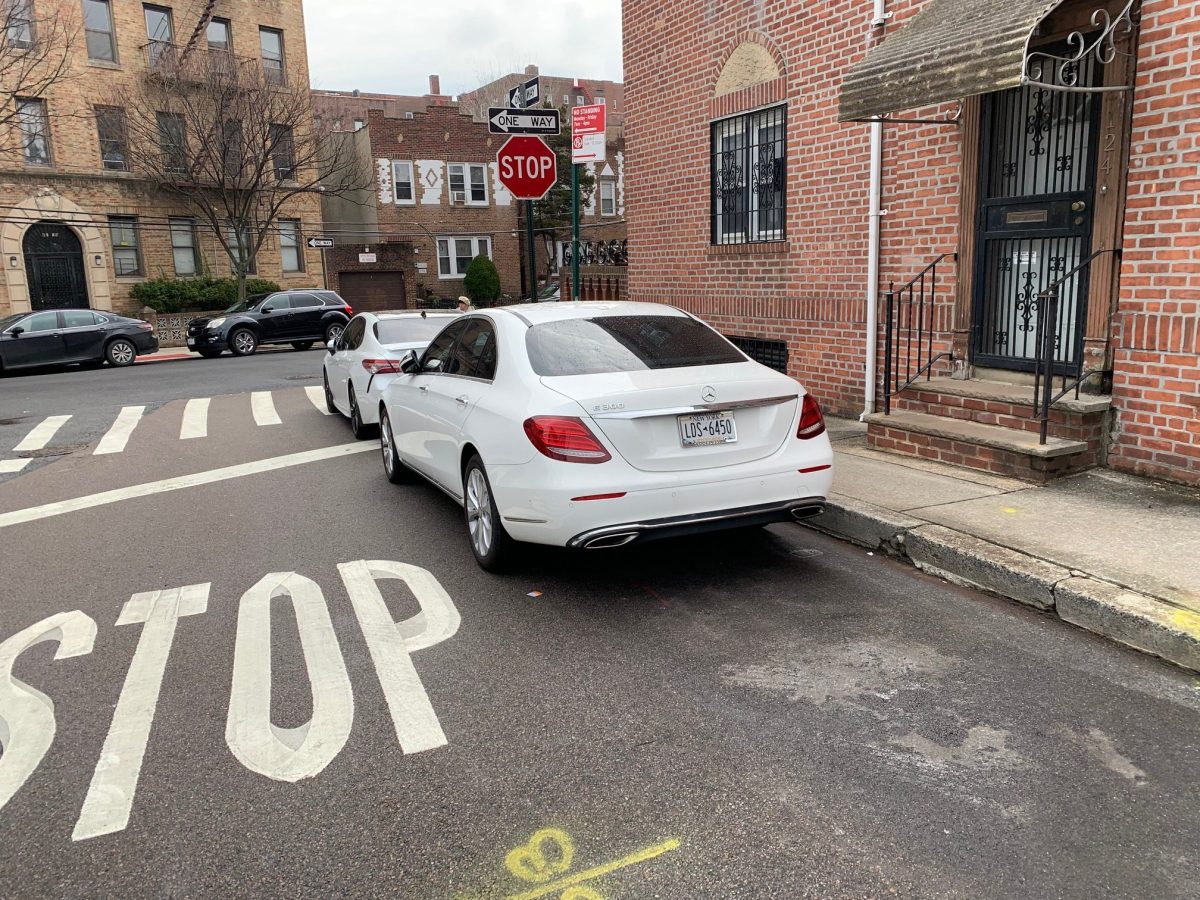 Cars parked near an intersection at 41st Drive and 60th Street in Queens