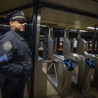 NYPD officer at NYC subway turnstile