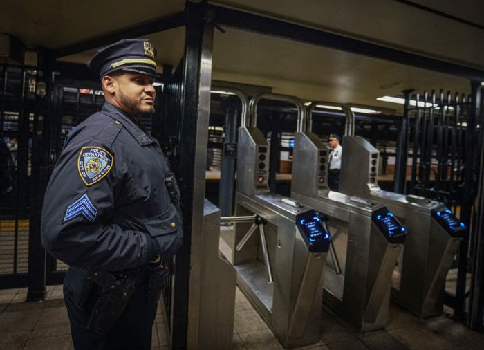 NYPD officer at NYC subway turnstile