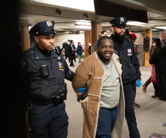 Manhattan subway attack suspect arrested and smiling for pushing woman into moving train