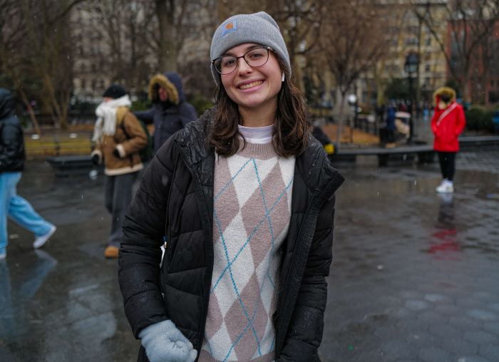 a woman standing outside in NYC where she discussed a possible TikTok ban