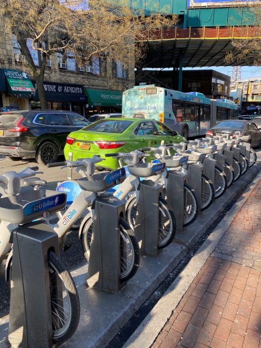 a Citi Bike set parked on the street in Queens