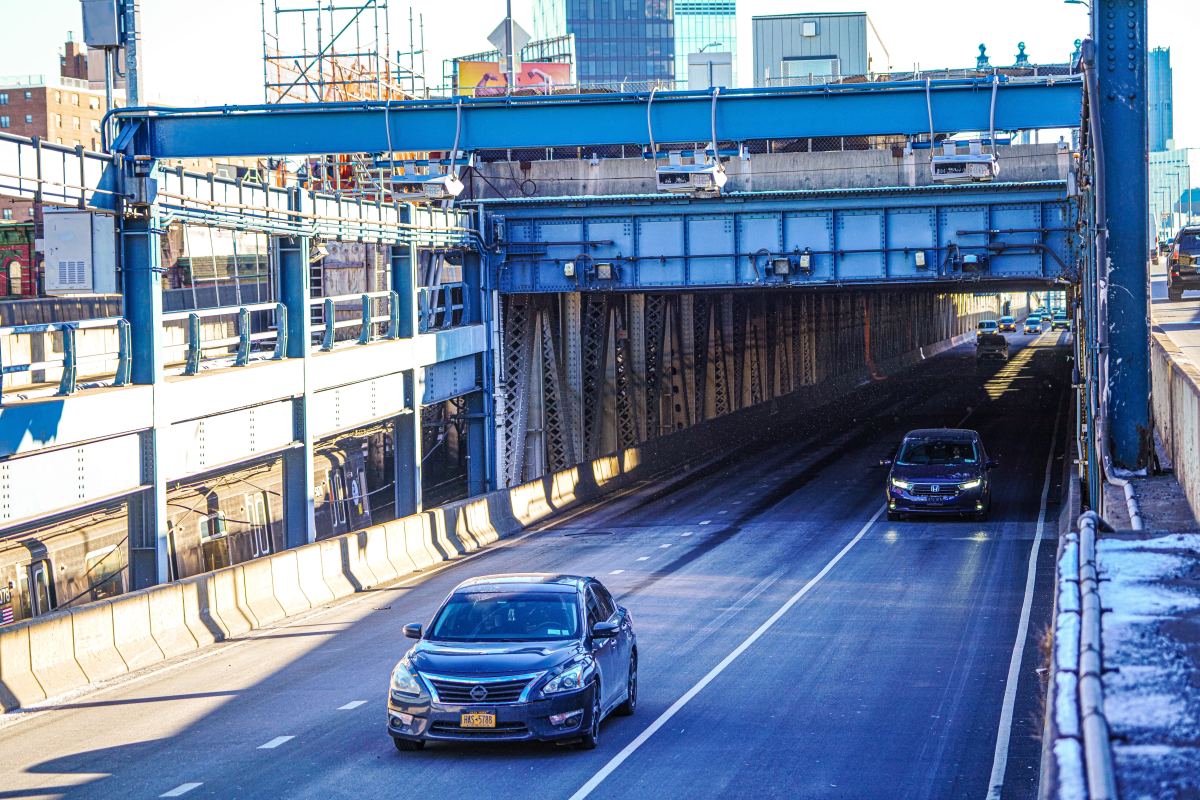 Cars pass under the toll gantries at the Manhattan Bridge amid congestion pricing in New York on Jan. 7, 2025.