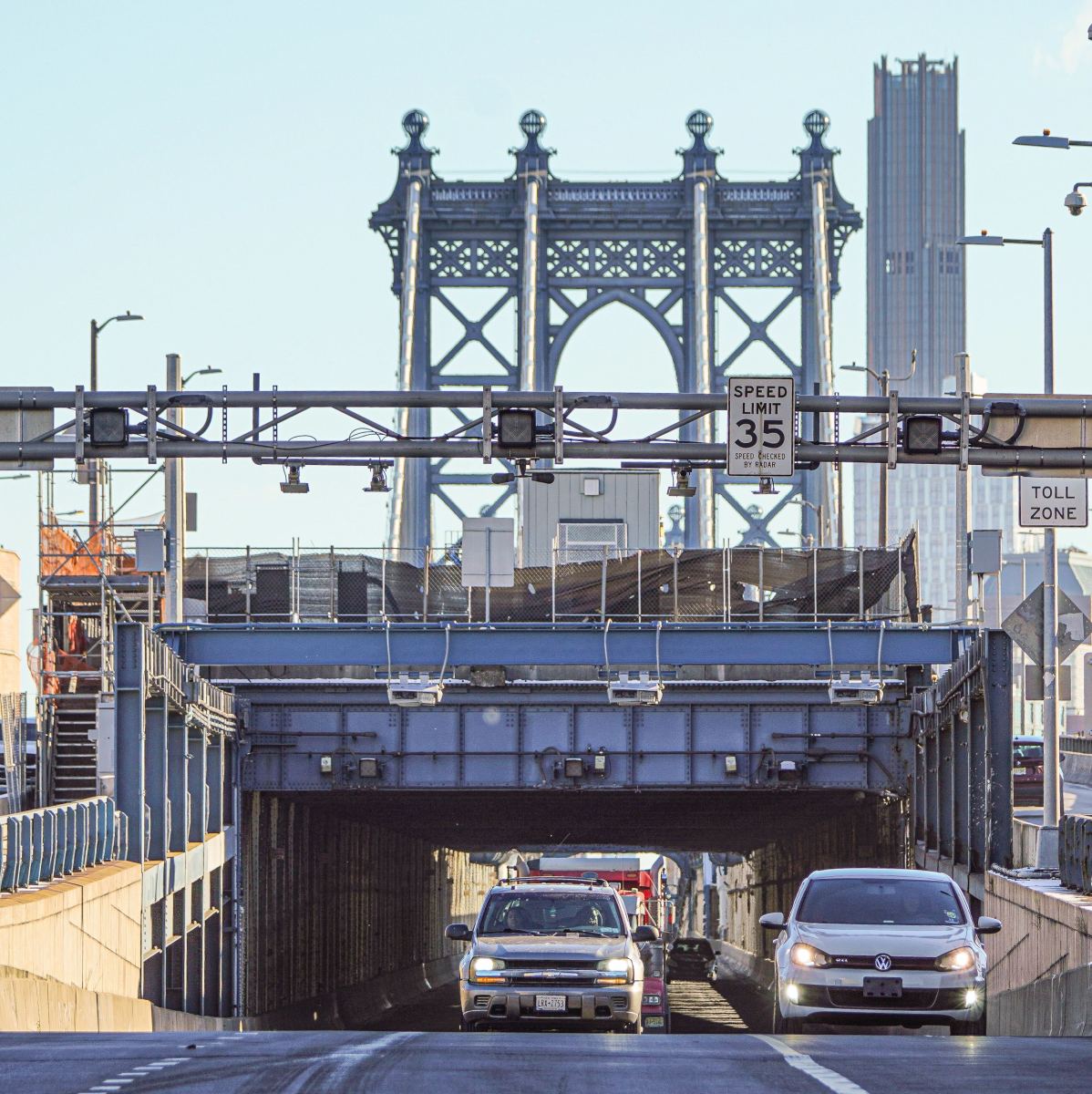 Cars pass under the toll gantries at the Manhattan Bridge amid congestion pricing in New York on Jan. 7, 2025.