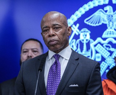 The embattled mayor was holding a press conference inside of the Bronx’s 40th Precinct less than 24 hours after attending a court hearing on the decision of the DOJ dropping charges against him when the tense interaction unfolded.